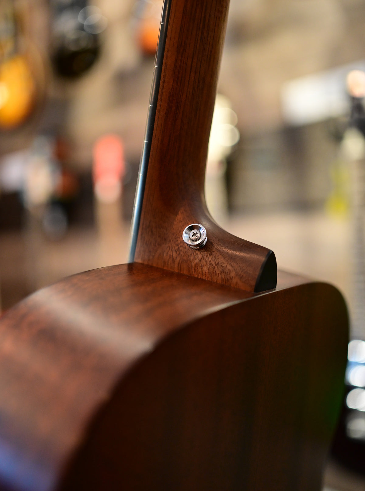 Close-up of the used Martin 000RS1 neck heel and strap button
