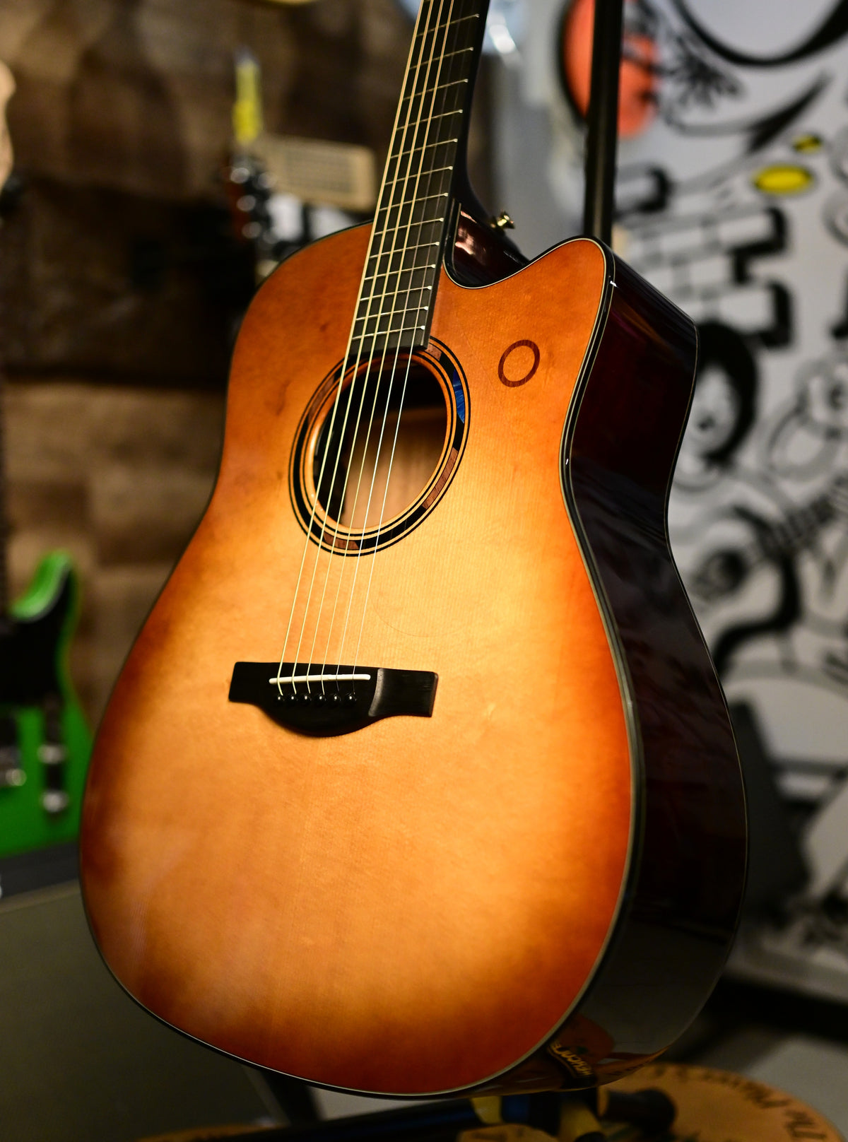 Yamaha TAG3 C TransAcoustic in Sand Burst on a stand, angled body view